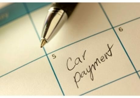 You may qualify for an auto title loan even if you're still making monthly car loan payments.